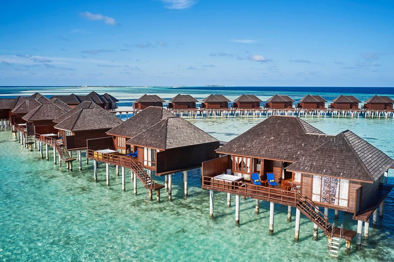 a row of overwater villas in the maldives