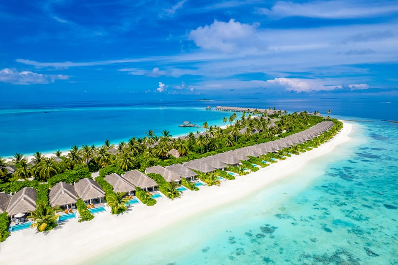 aerial view of sun siyam resorts villas in a line