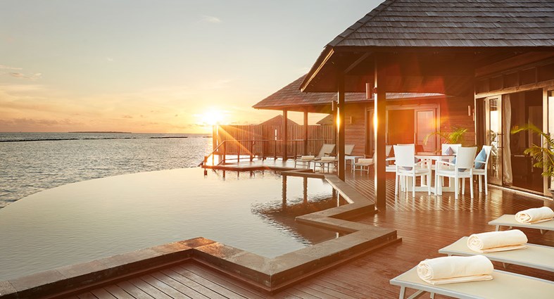 sunset view from large maldives villa with pool